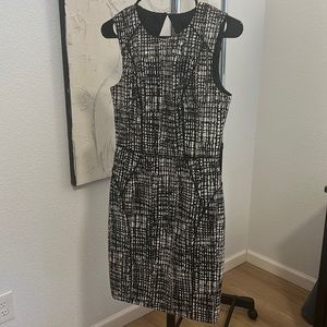 H&M black and white dress with black piping.  Open triangle back.